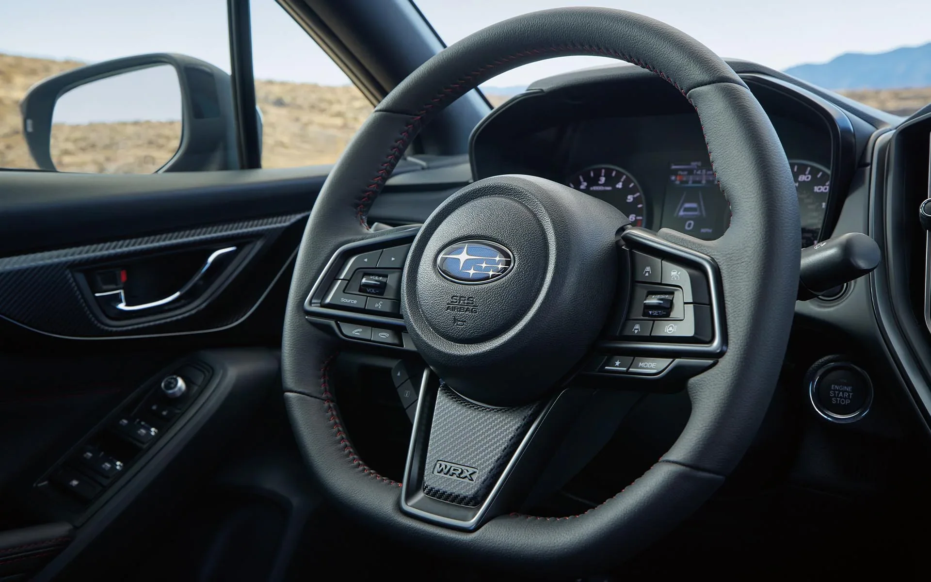 A close up of the D-shaped steering wheel in the 2022 Subaru WRX