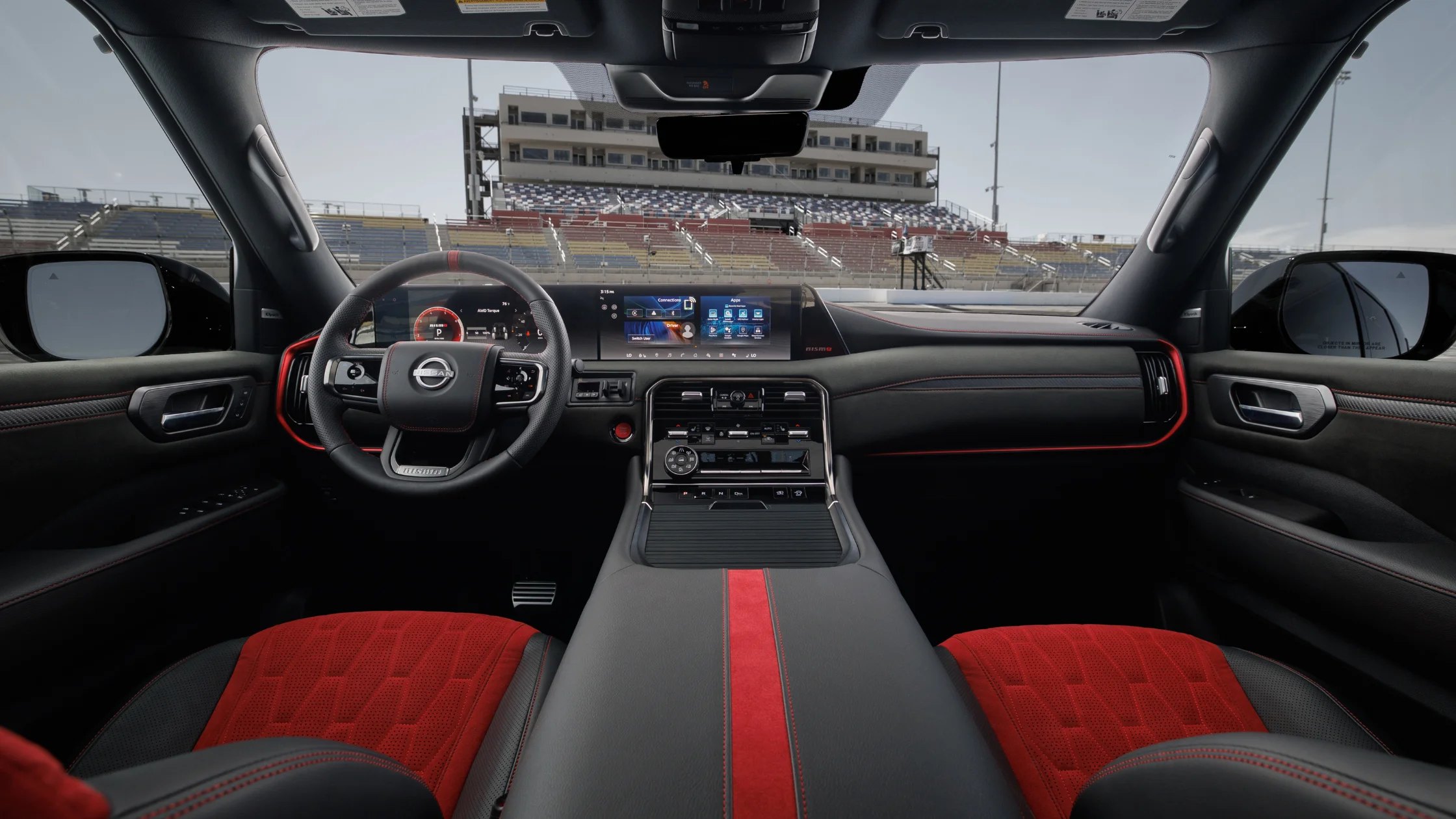 2026 Nissan Armada® NISMO parked in front three quarter view at a racetrack