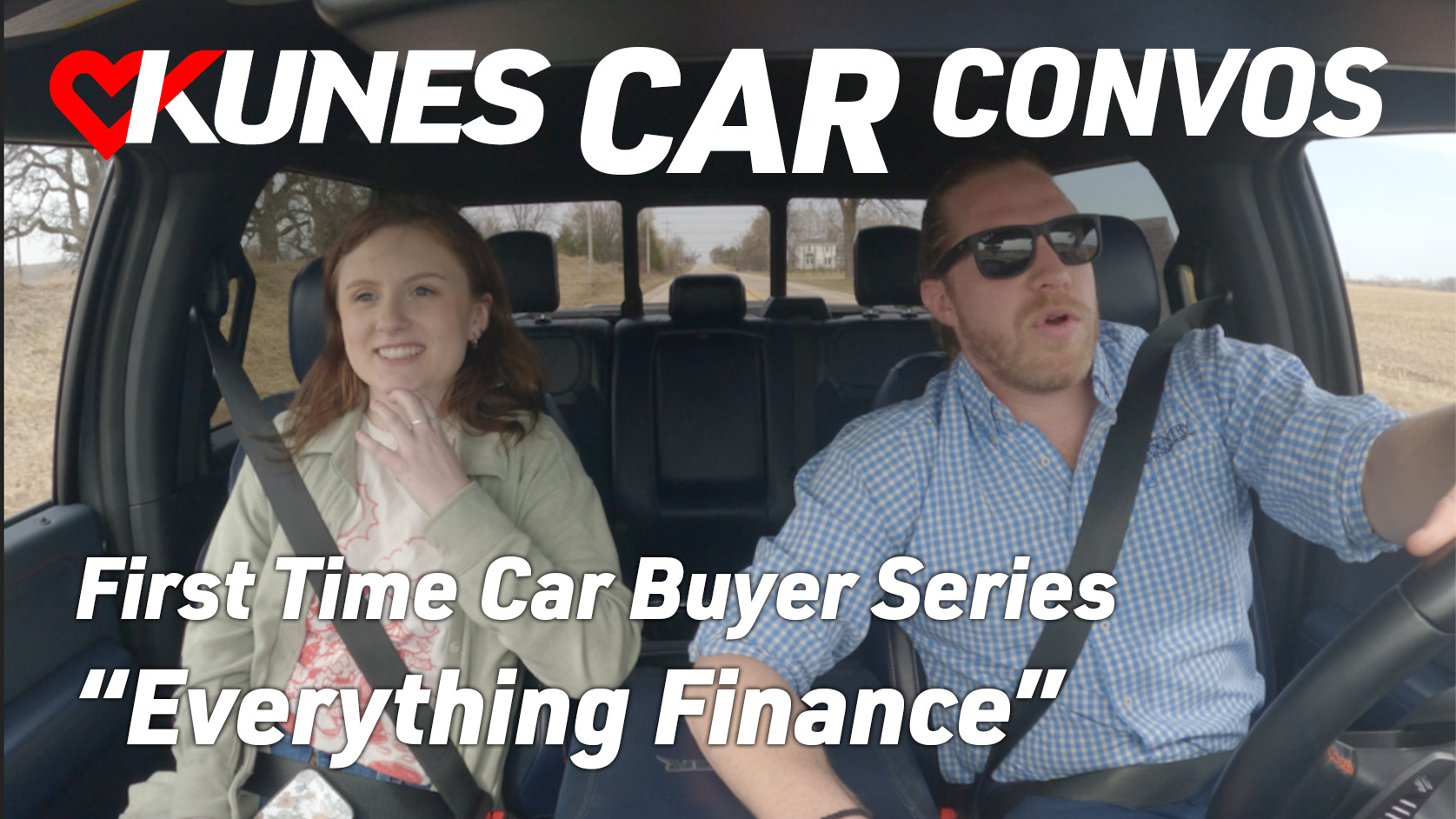 Text reads: Kunes Car Convos; Mike Kramp CEO of Geneva Lakes YMCA
Photo: Mike Kramp, CEO of Geneva Lakes YMCA, and Jen Myers, Marketing Director of Kunes Auto & RV Group, smile at each other while driving in a 2023 Grand Cherokee 4XE