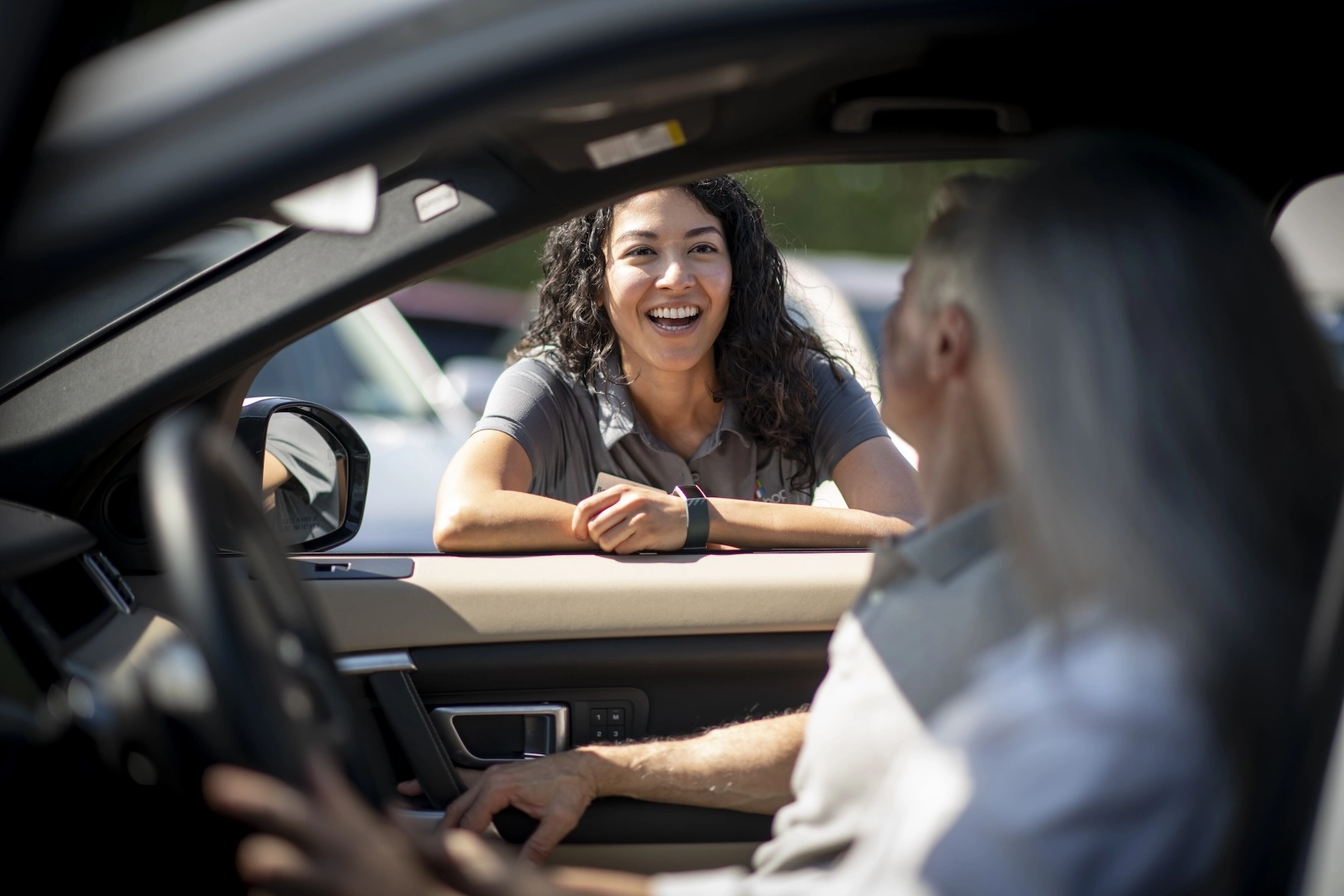 Person speaking to other people in car