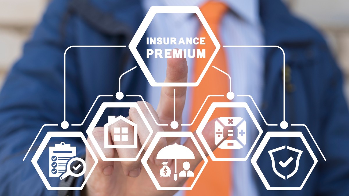 Businessman Using Virtual Touchscreen Presses Insurance Premium Inscription