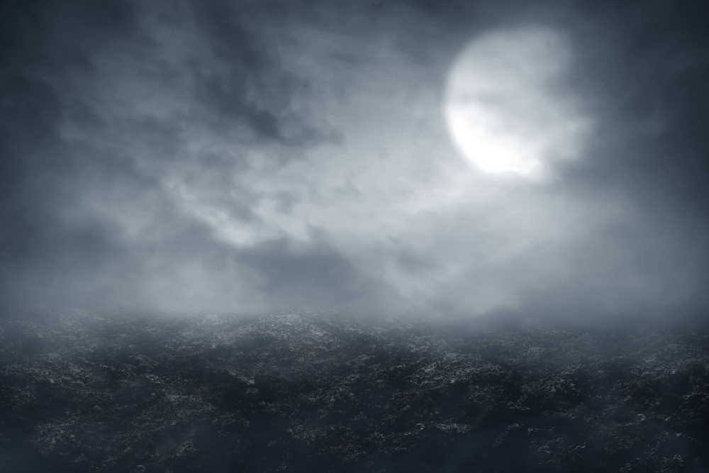 a moonlit sky covered in clouds; spooky looking