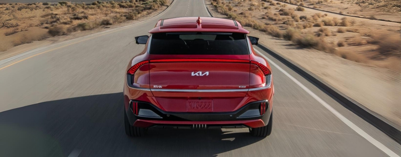 Red 2024 Kia EV6 GT driving to a Kia dealer near Monticello