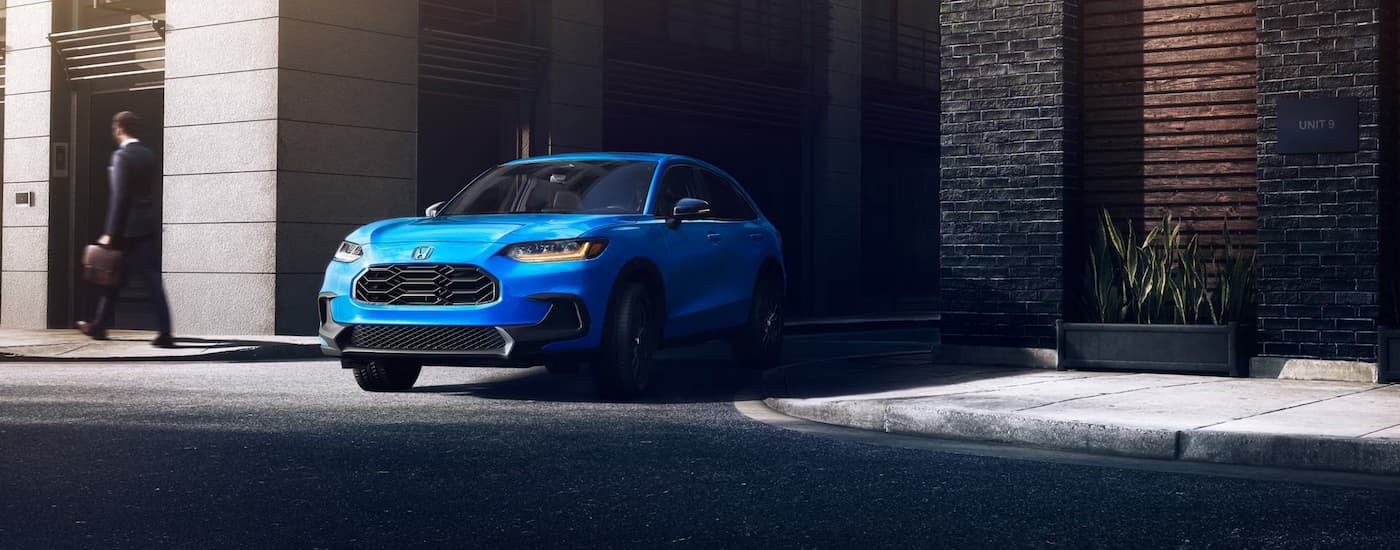 Blue 2026 Honda HR-V turning out of an alleyway