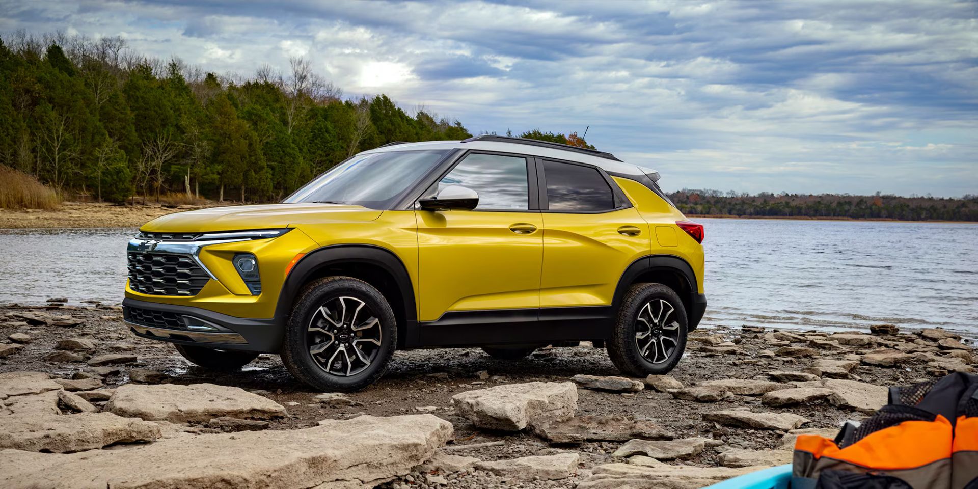 A yellow car sitting parked.