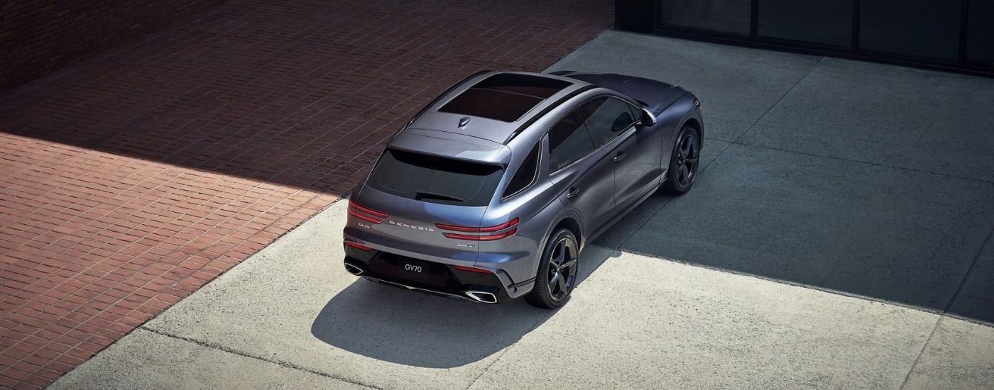 Rear birds-eye view of a gray 2026 Genesis GV70.