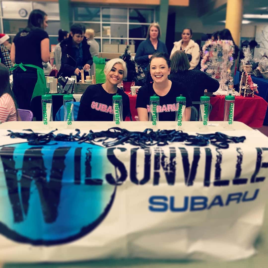 Wilsonville Subaru volunteers at a school pop-up shop table