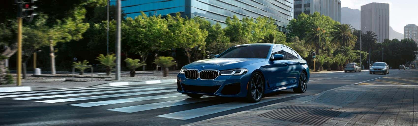 2022 BMW 5 Series driving through city