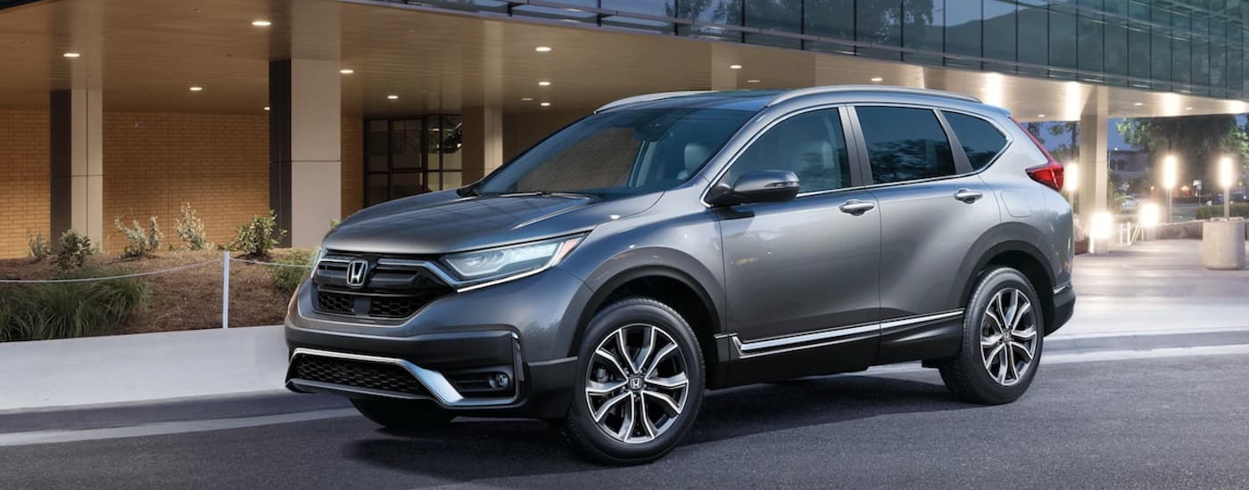 Grey 2020 Honda CR-V Touring parked in front of a building