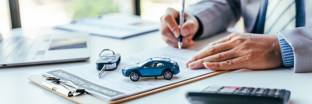 Automotive Insurance Policy Being Signed