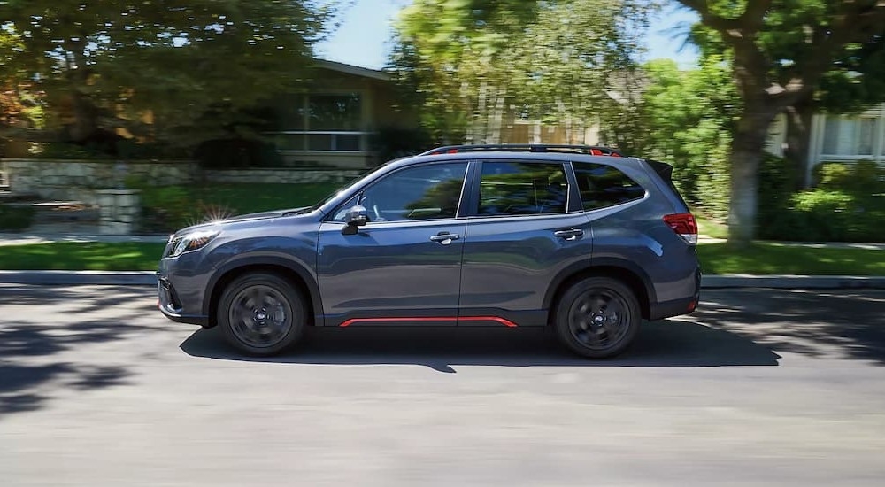 A gray 2024 Subaru Forester Sport is shown driving