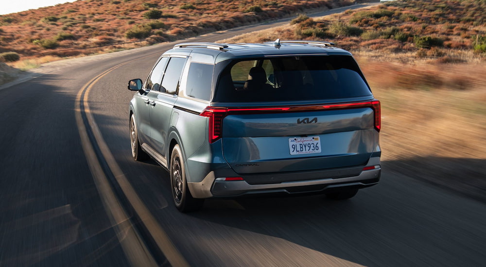 Rear of a blue 2026 Kia Carnival
