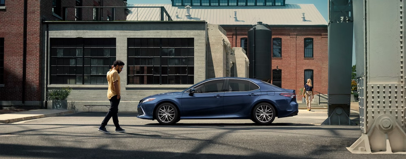 A blue 2023 Toyota Camry from the side after leaving a dealer that has used cars for sale near Flora Vista.
