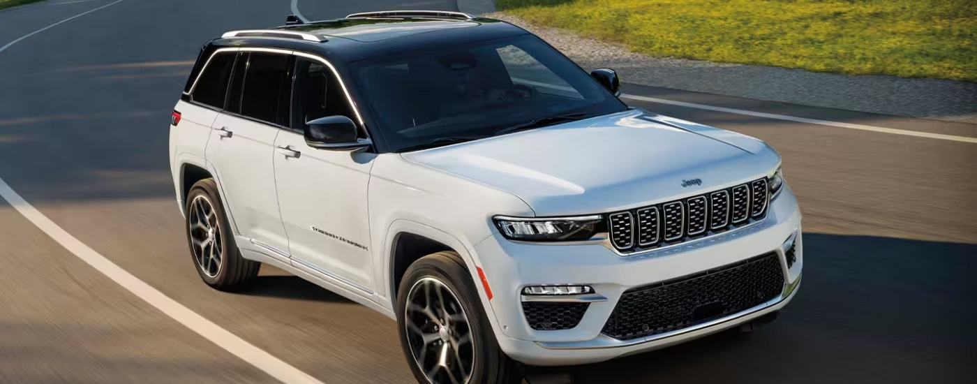 A white 2024 used Jeep Grand Cherokee for sale from the front.