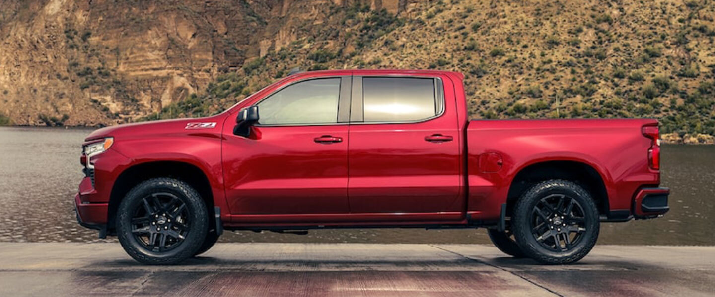 A red Chevy Silverado 1500 parked.