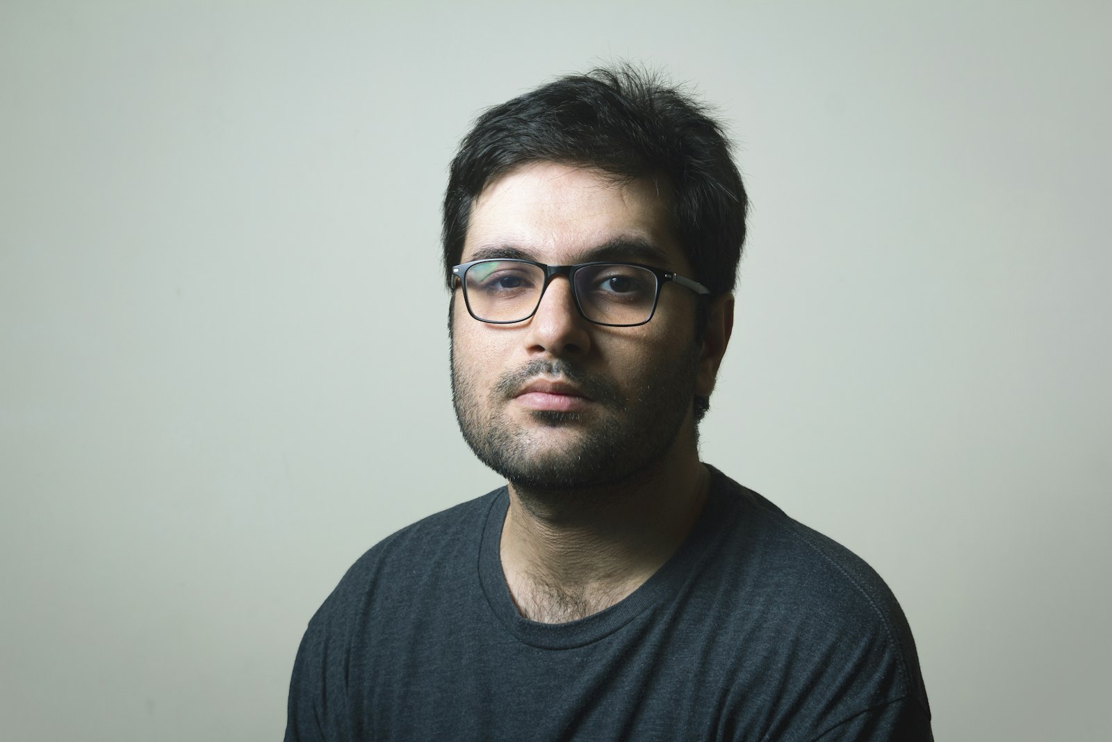 Technician installing accessories on a pickup truck in a service bay