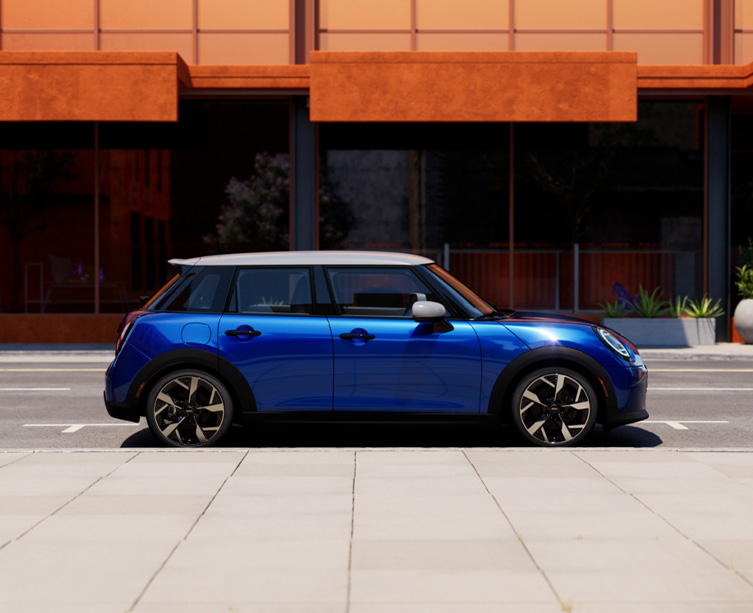 Side profile shot of metallic blue MINI Cooper 4 door. 