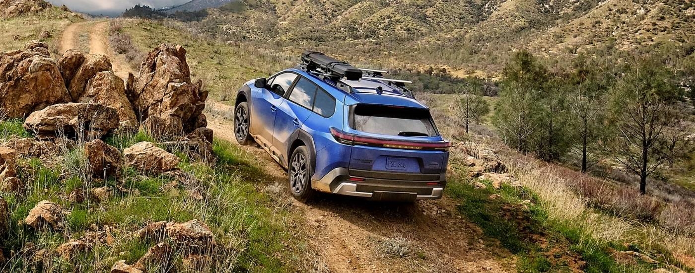 Blue 2026 Subaru Trailseeker driving on a trail
