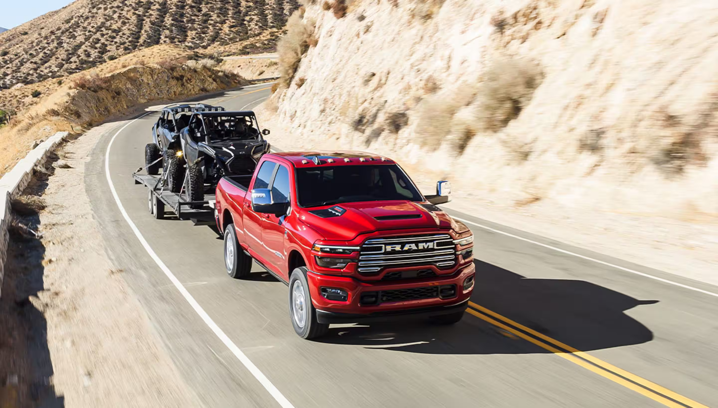 A red truck driving on the road.