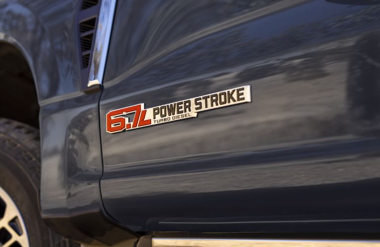 Close Up of Blue 2024 Ford Super Duty with 6.7-Liter Power Stroke Diesel Badge