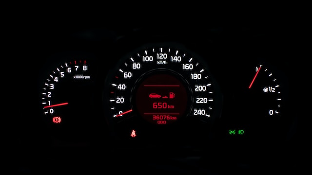 dashboard speedometer illuminated in the dark