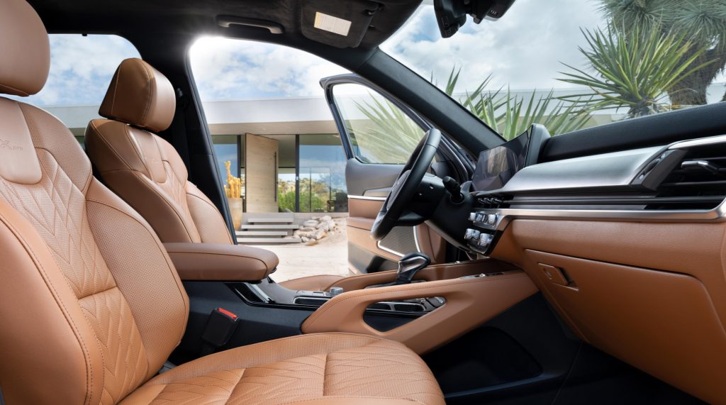 Tan interior of a 2025 Kia Telluride is shown from the drivers side