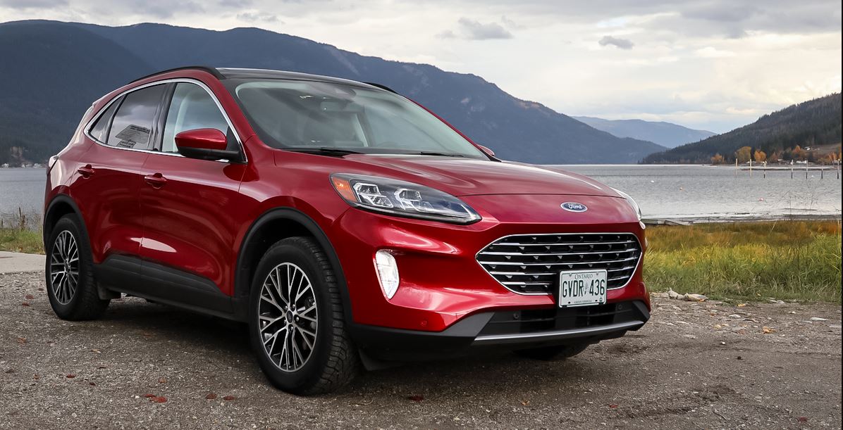 Red 2023 Ford Escape PHEV parked on a shoreline