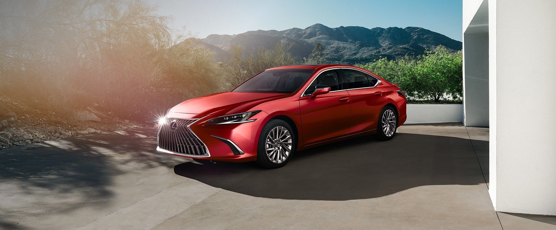 Exterior of the Lexus ES Hybrid shown in Matador Red Mica.