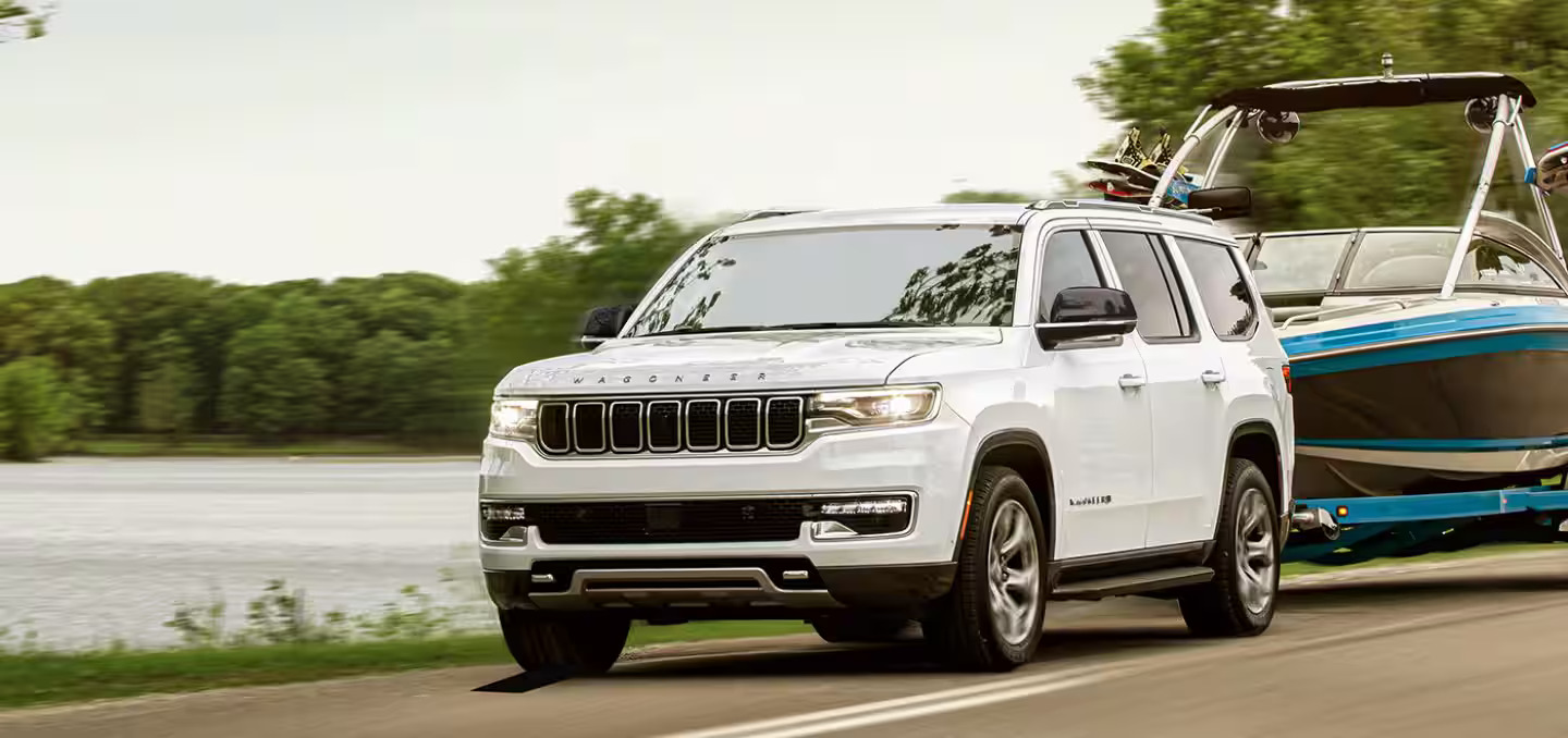 The 2024 Jeep Wagoneer pulling a boat.
