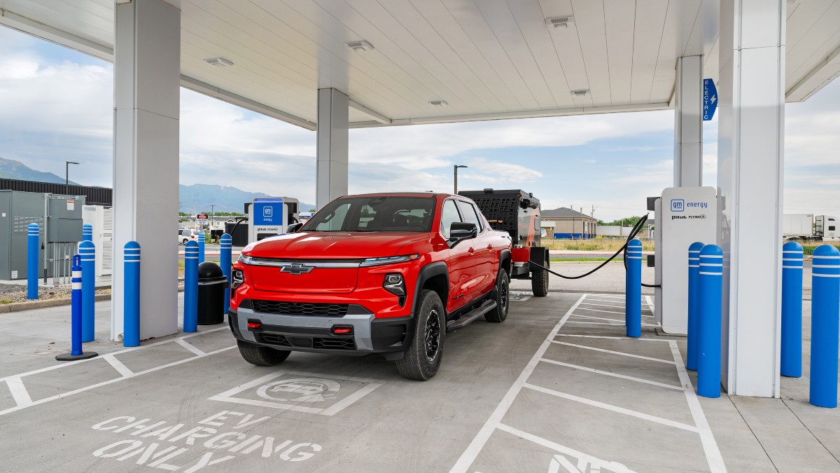 2026 Chevy Silverado EV Trail Boss Exterior Driver Side Front Angle at Charging Station