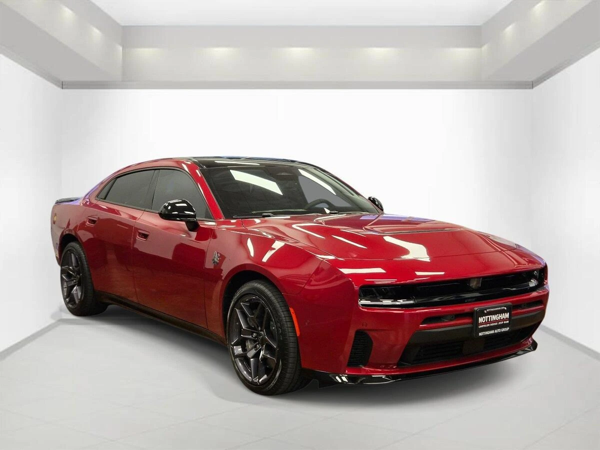 Red 2026 Dodge Charger Scat Pack four-door, front three-quarter view