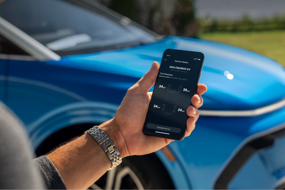 Person Holding Phone with MyChevrolet App Open
