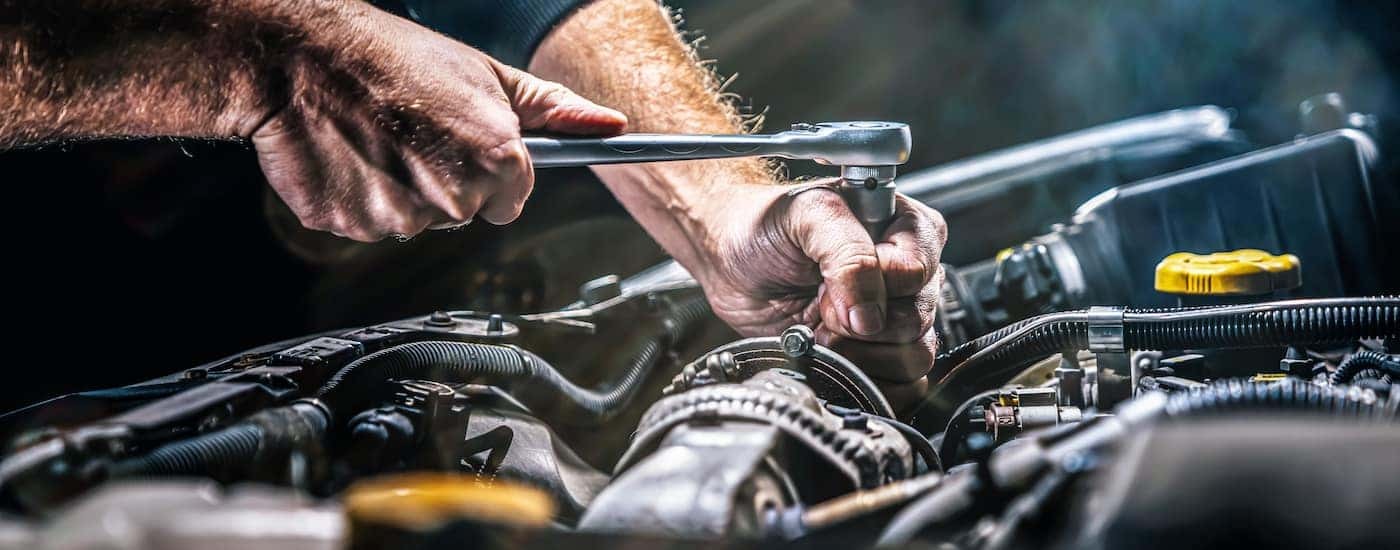 A mechanic working on an engine at a transmission shop in Rochester.