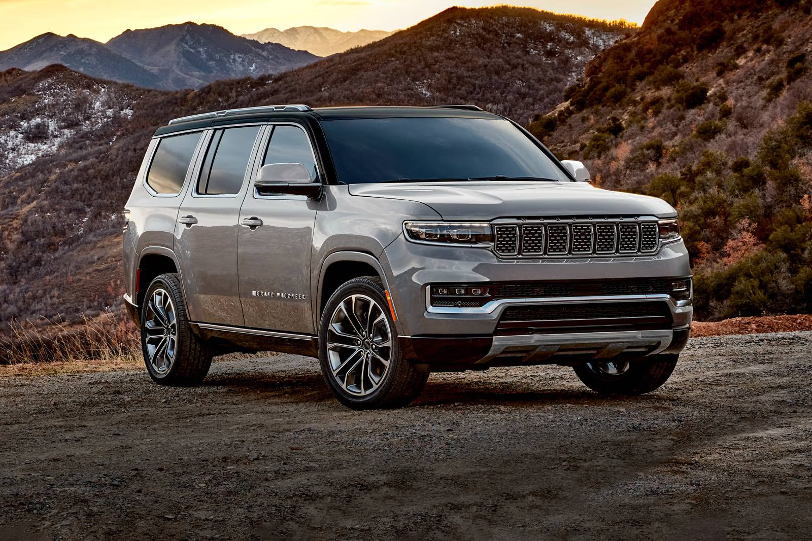 A silver suv sitting parked.