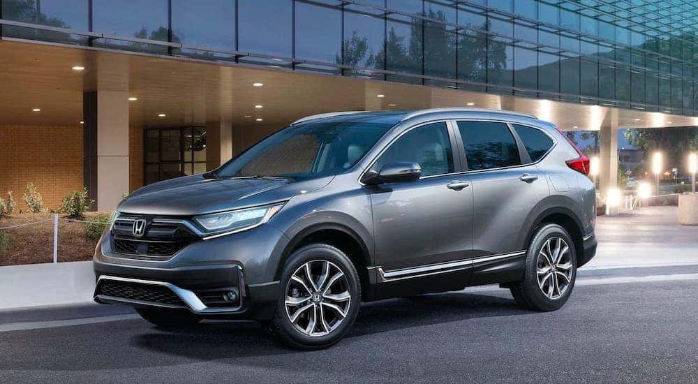 Grey 2020 Honda CR-V Touring parked outside a Honda dealer near me.