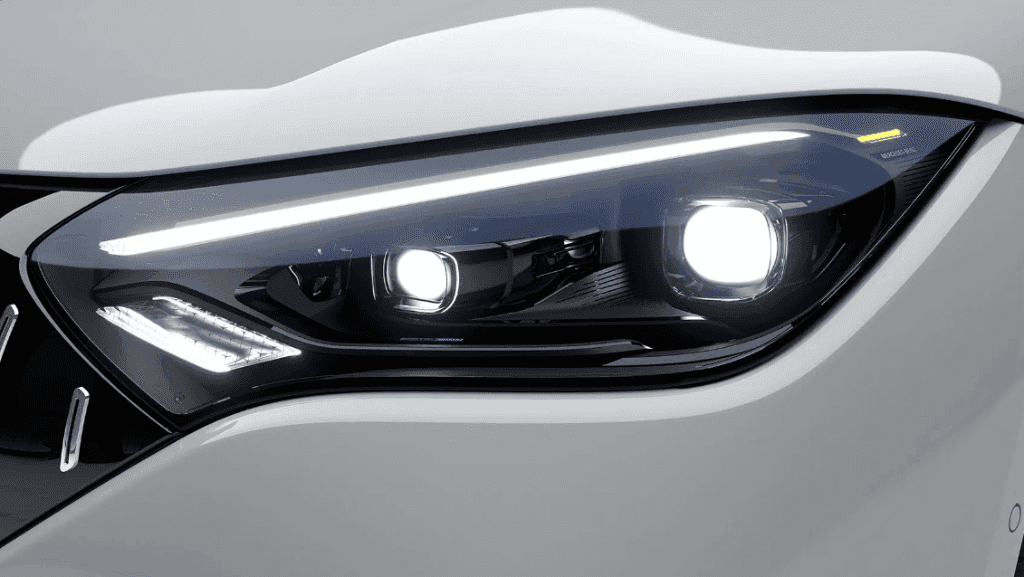 The front lights of a white luxury electric vehicle.