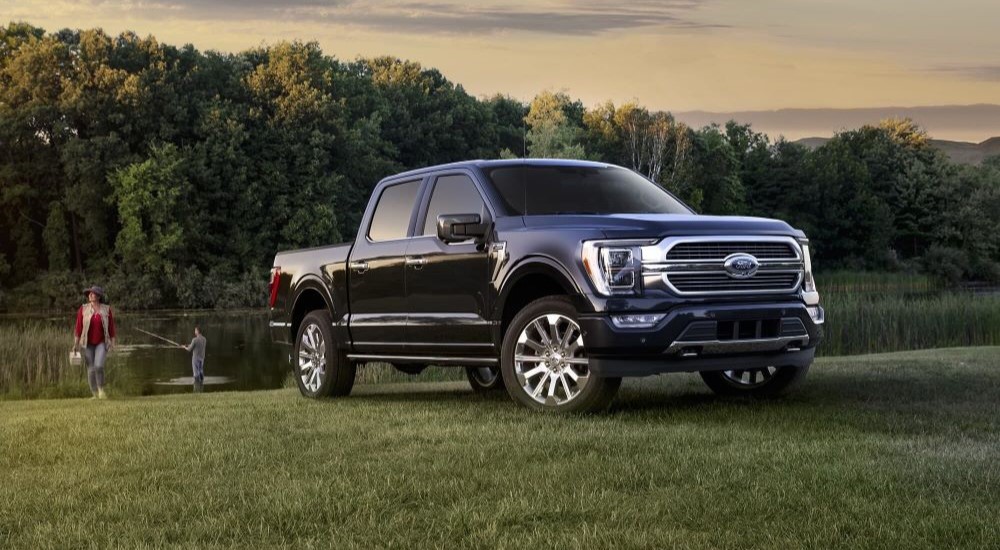 Blue 2023 Ford F-150 parked by a pond