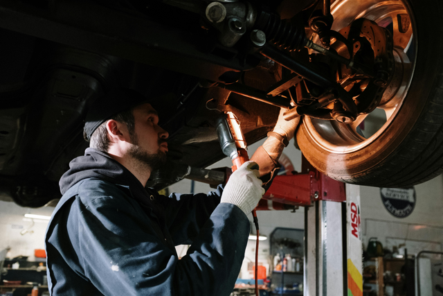 a man servicing a car