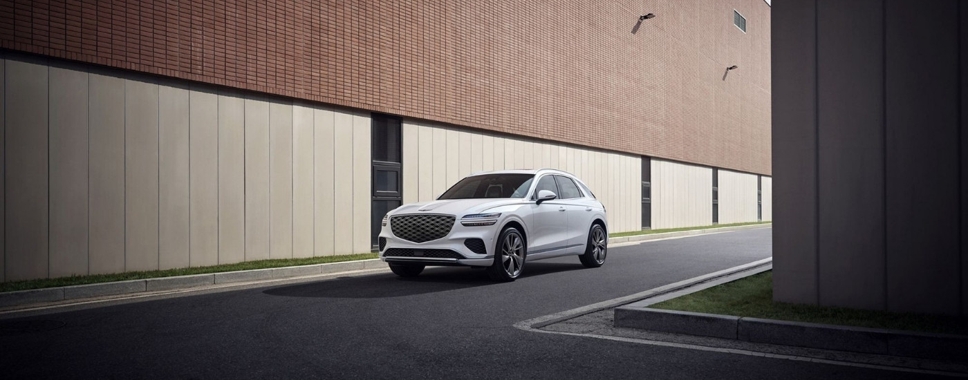 White 2026 Genesis GV70 for sale in Montgomery parked near buildings