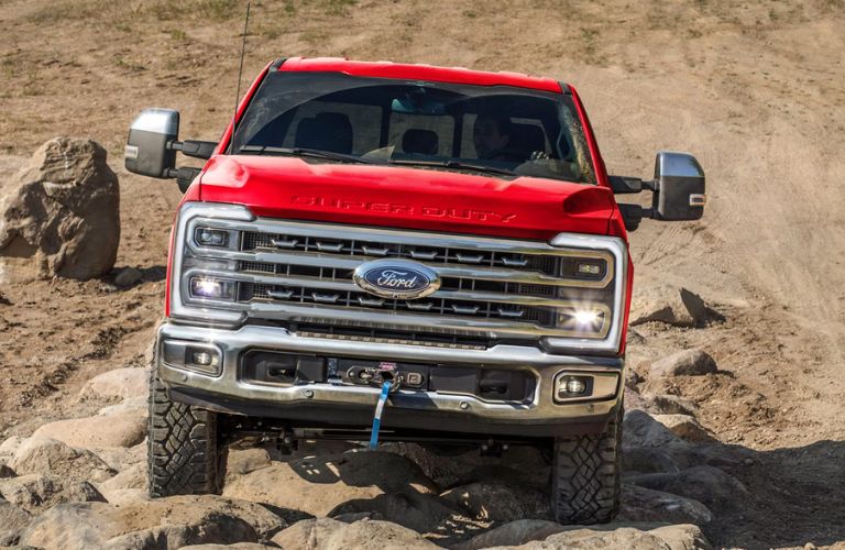 Red 2025 Ford Super Duty with Tremor Package on Rocky Trail