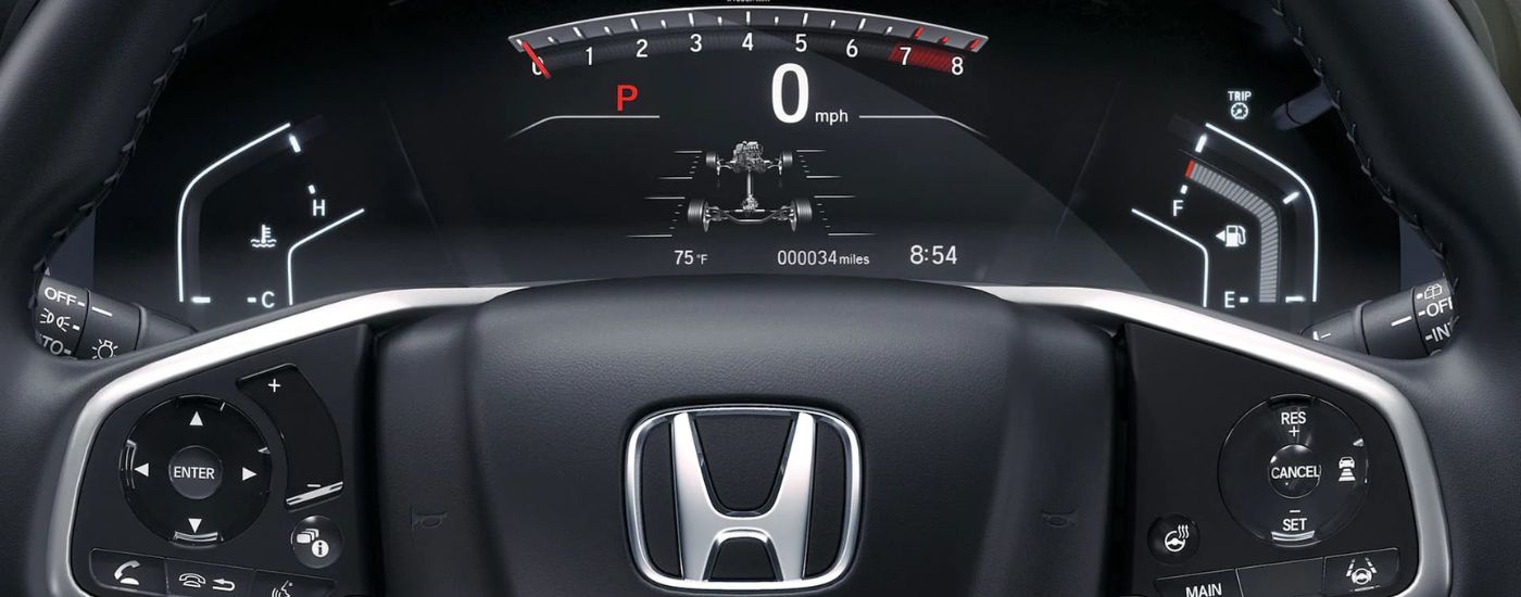 Interior of a 2021 Honda CR-V Touring shows the steering whee