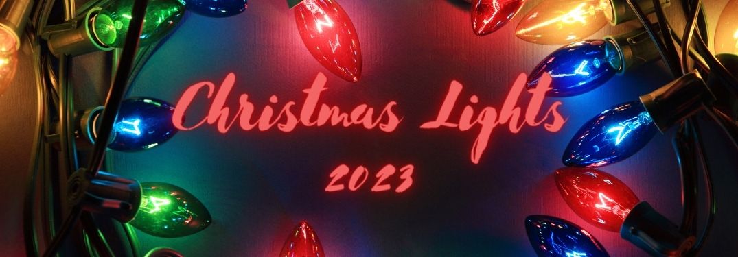 Close Up of Christmas Lights with Red Christmas Lights 2023 Text