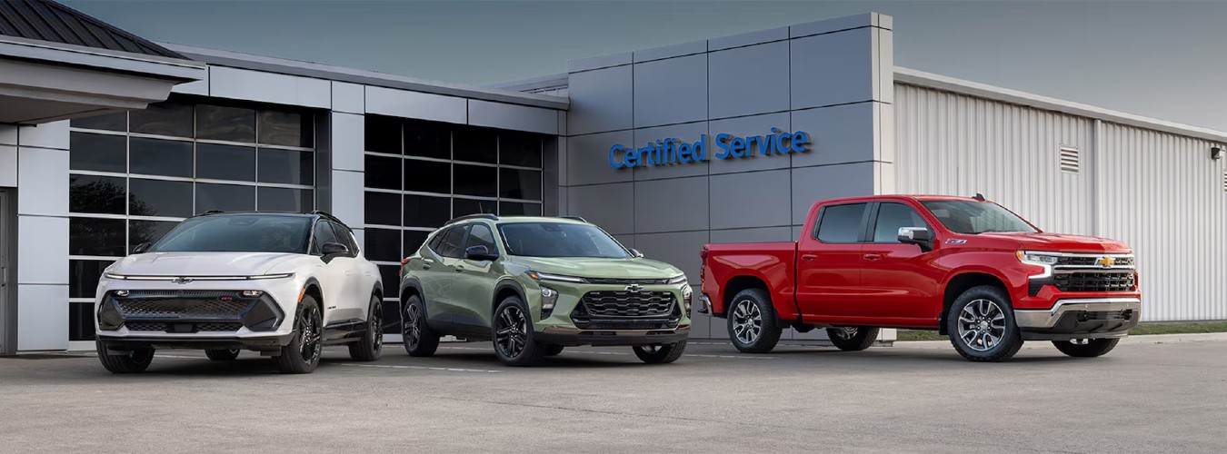 2024 Chevy Models in front of Service Building