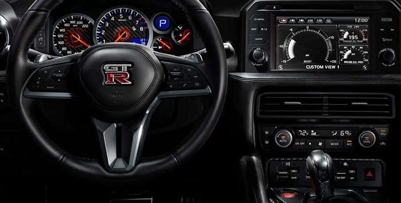 Nissan steering wheel, gauge cluster and center console