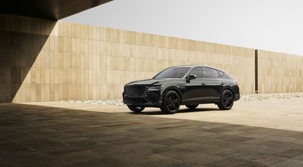 Black 2026 Genesis GV80 Coupe parked near a wall after looking at luxury SUVs for sale