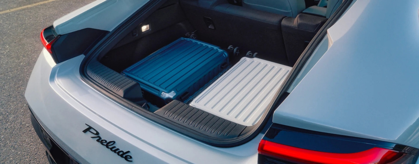 Luggage in the trunk of a white 2026 Honda Prelude