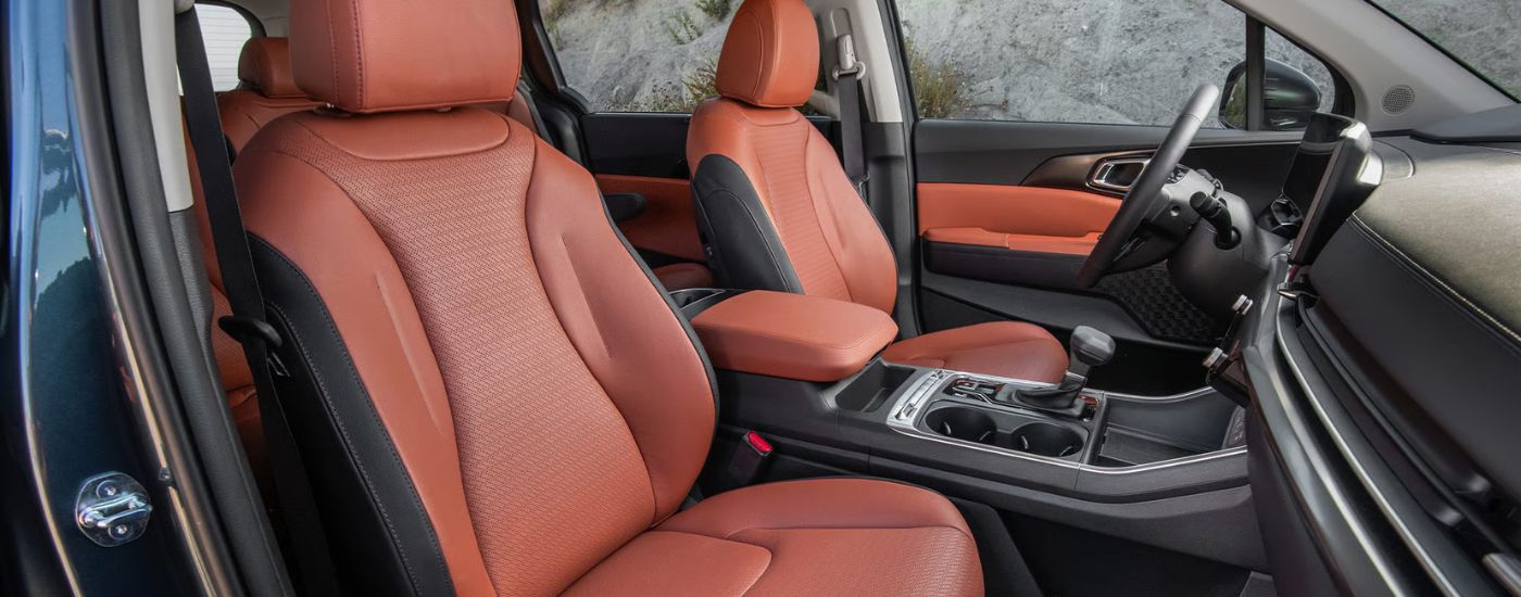 The front driver and passenger seats in a 2026 Kia Carnival.