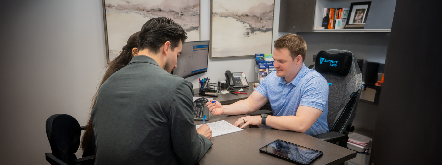 Finance office going over numbers with customers