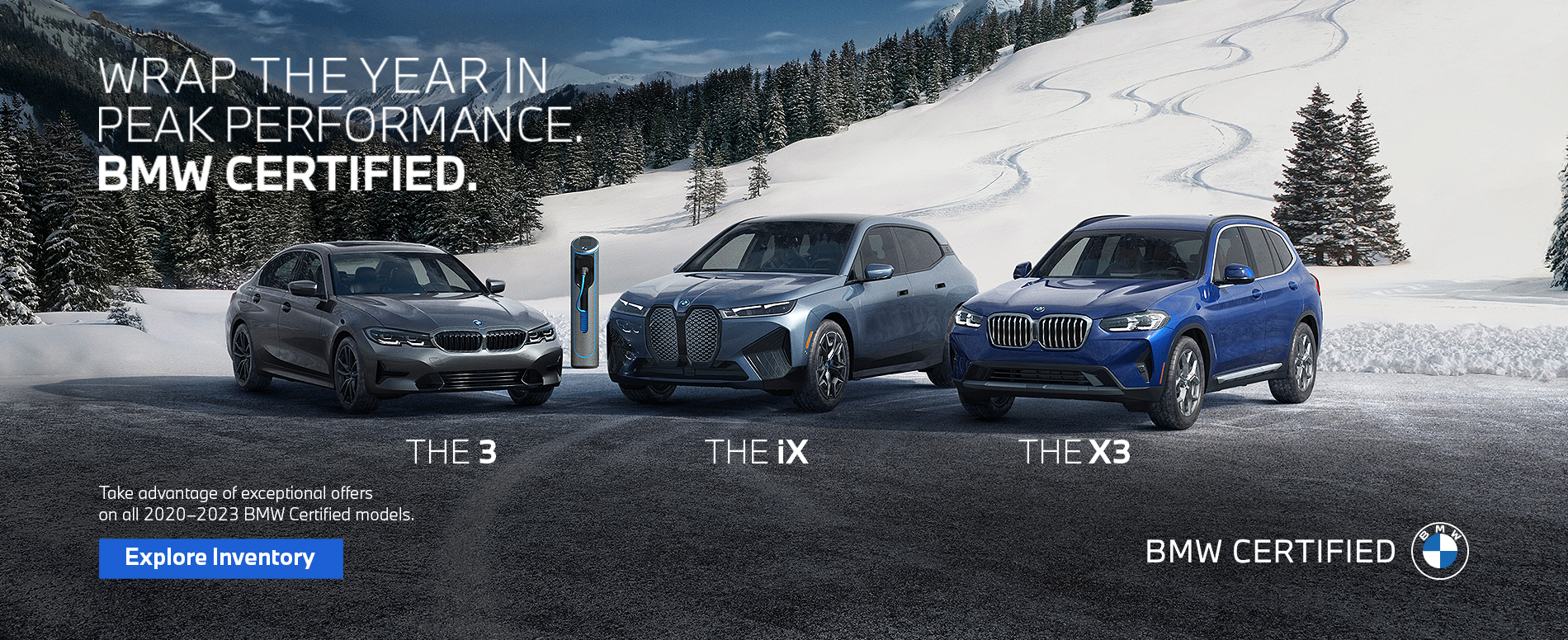 BMW vehicles parked on a street with a snow covered hill in the background.