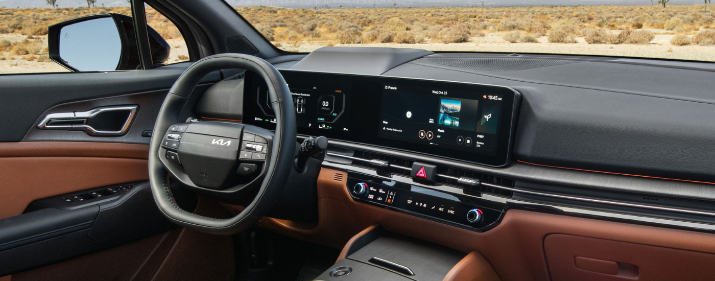 Brown and black leather interior of a 2026 Kia Sportage
